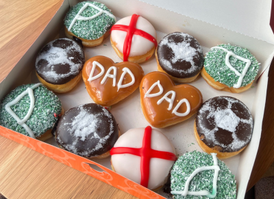 Box featuring some Father's Day Dad Donuts, and other Football related Donuts